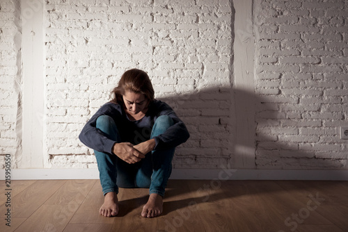 Canvas Print Young devastated depressed woman crying sad feeling hurt suffering depression in sadness emotion in pain and desperate expression