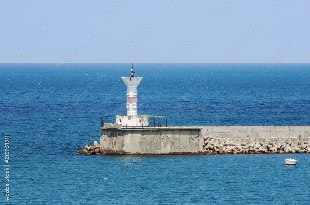 Russia, the peninsula of Crimea, the city of Sevastopol. 06/10/2018: Lighthouse at the entrance to the Sevastopol Bay
