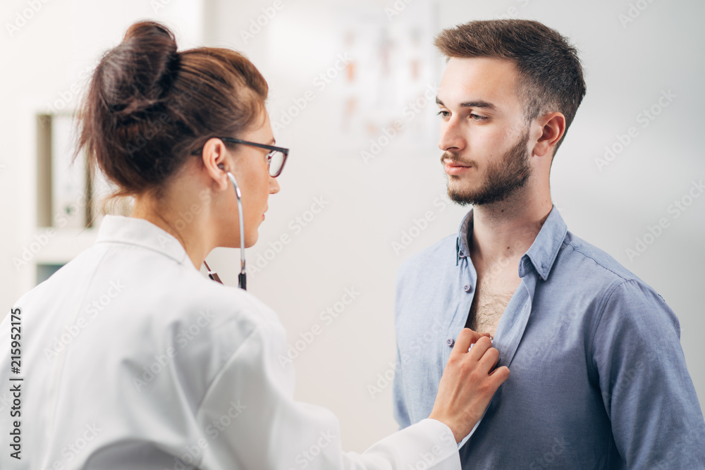 Doctor Examining Patient in Office Doctor Examining Patient in Office