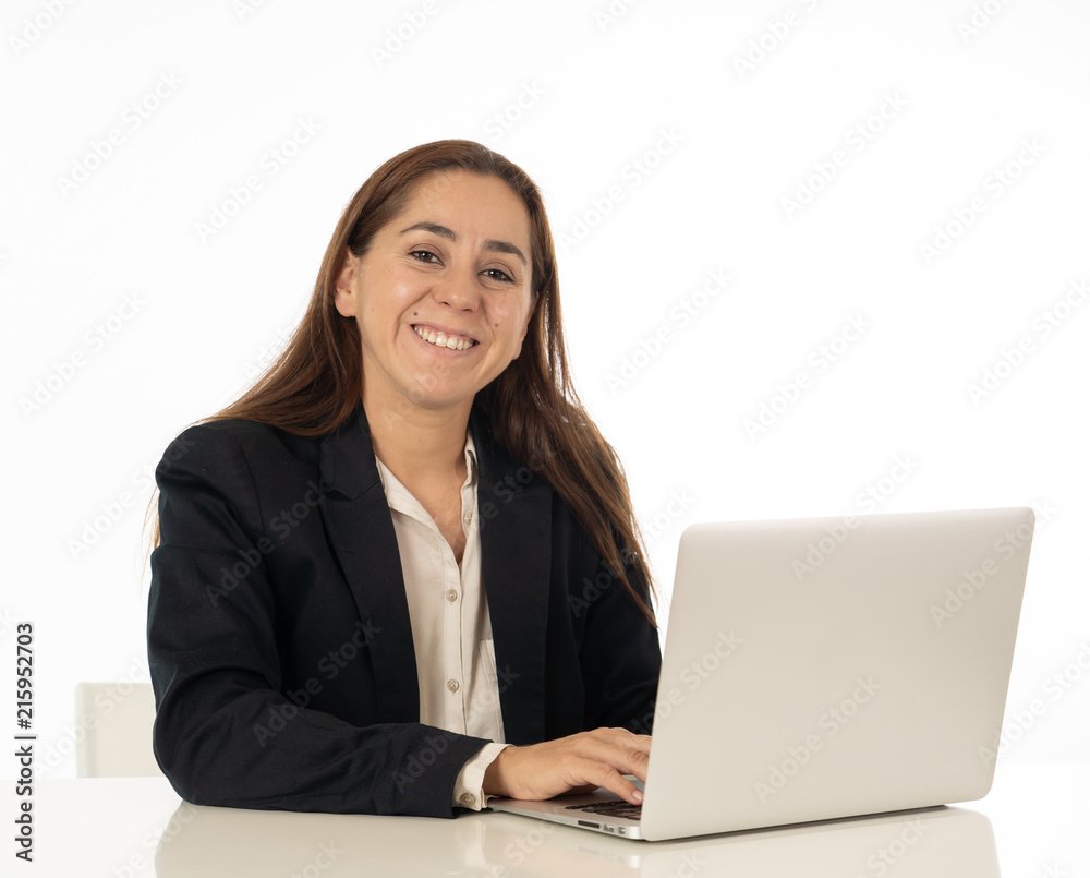 Happy young successful young woman working with laptop computer surfing on the internet sitting on her desk. White background. Happy young successful young woman working with laptop computer surfing on the internet sitting on her desk. White background.