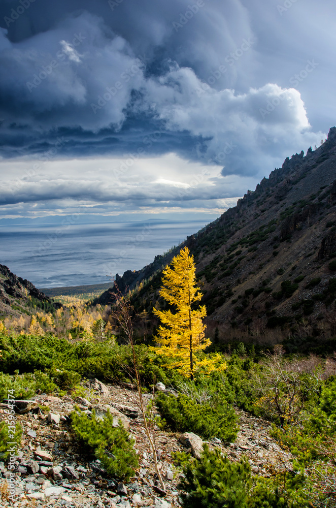 Sunny day at the mountains with colorfull clouds