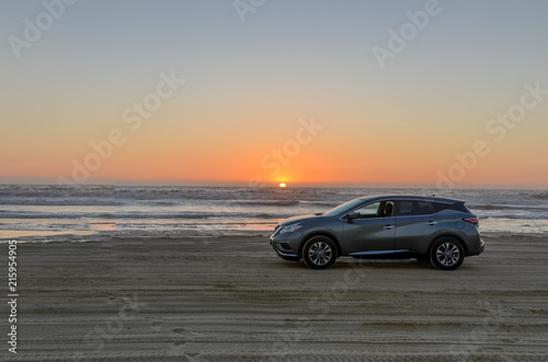 grey car on the sand beach at sunset Oceano Dunes SVRA, San Luis Obispo county, California, USA