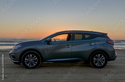 grey car on the sand beach at sunset Oceano Dunes SVRA  San Luis Obispo county  California  USA