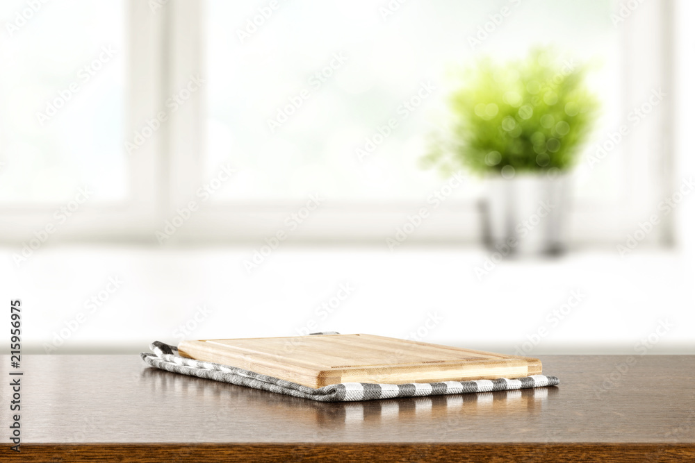 desk of free space and window background with small plant 