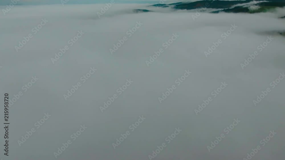 Drone shot during autumn over the fog. Drone shot during autumn over the fog.