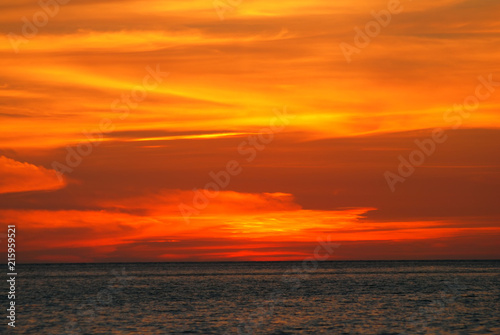 Orange light in the twilight on sea.