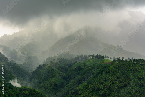 Fototapeta Naklejka Na Ścianę i Meble -  Cloudy mountain landscape. Negros Island Philippines. Gloomy landscape in the mountains - fog and clouds thicken in the mountains. Asia