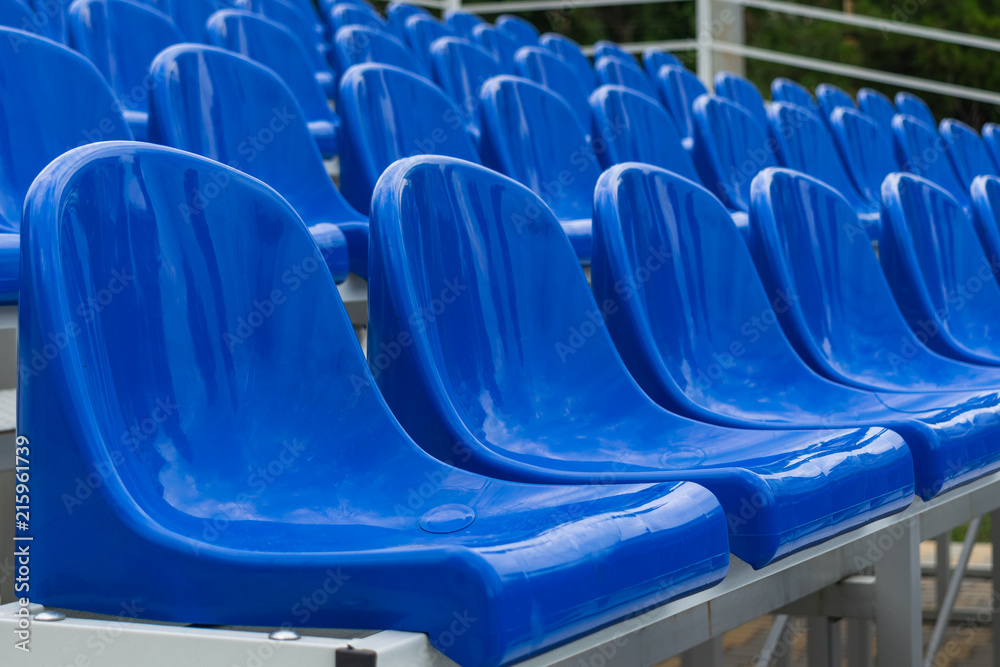 Fototapeta premium Blue empty seats in an open air amphitheater