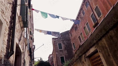 Walking through the old vintage-styled streets of Venice in Italy. photo