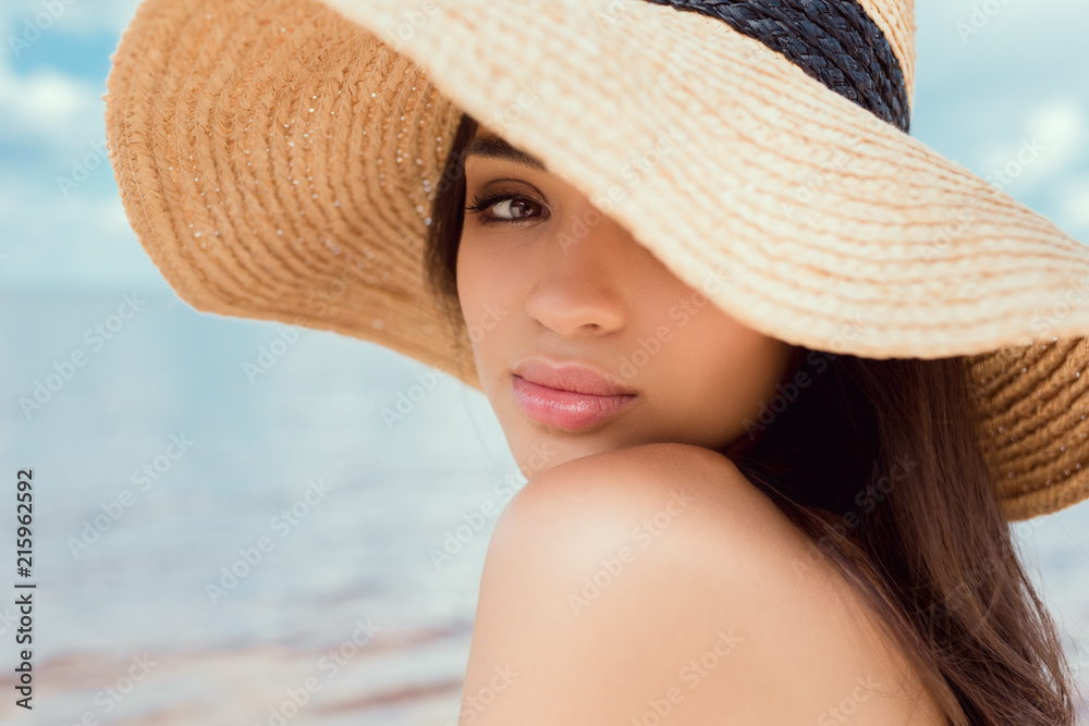 attractive caucasian girl posing in straw hat
