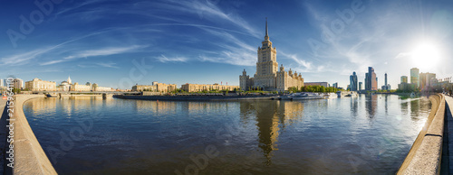 Sunny panoramic view of Smolenskaya embankment and Moskva river, Moscow, Russia.