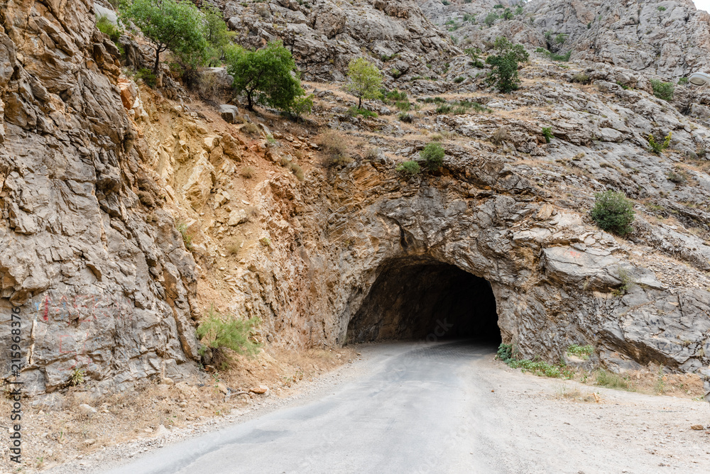 View of dark old long tunnel used to to go Town of Kemaliye