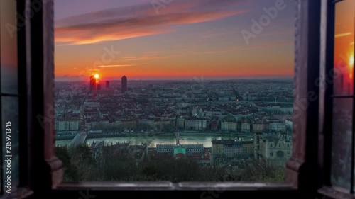 Lyon cityscape aerial view seen through window timelapse night to day
