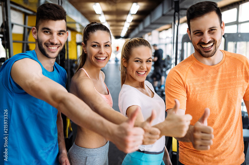 Picture of cheerful fitness team in gym