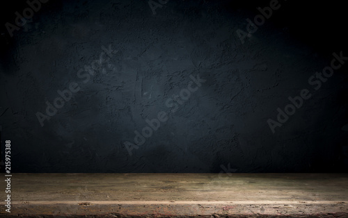 Dark room with tile floor and brick wall background