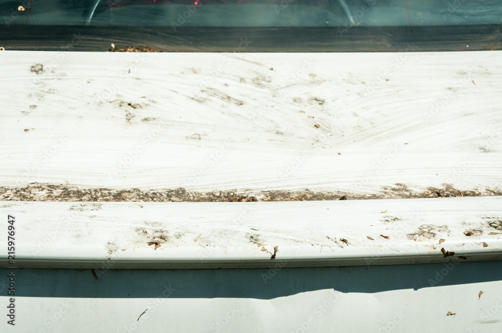 Extreme dirty white car trunk with dust close up selective focus Extreme dirty white car trunk with dust close up selective focus