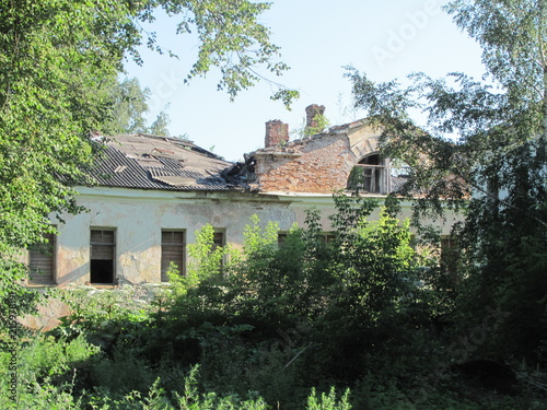 Old ruined white house in Pskov, Russia
