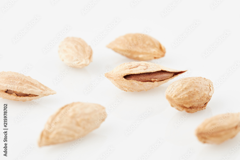 almonds with rind on white fund almonds with rind on white fund