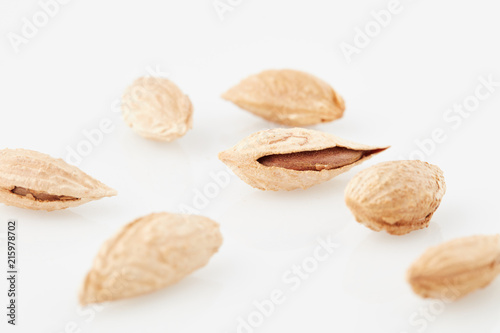 almonds with rind on white fund
