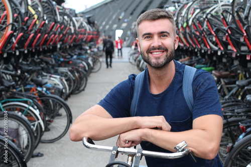 Joyful man in bicycle 3D parking lot