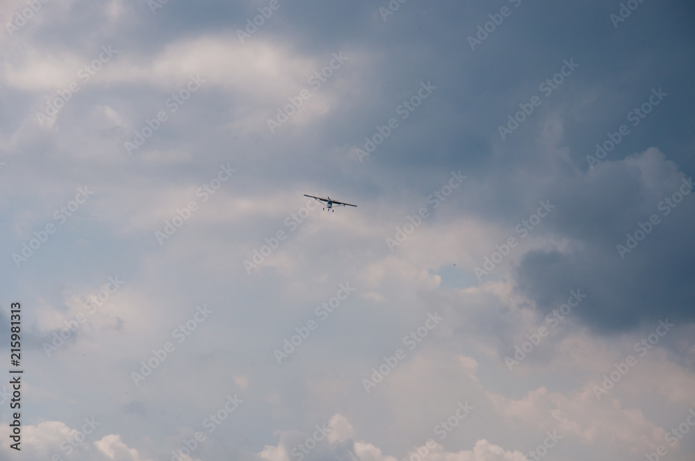 White plane in the blue sky. The concept of travel, recreation and technology. The aircraft is landing