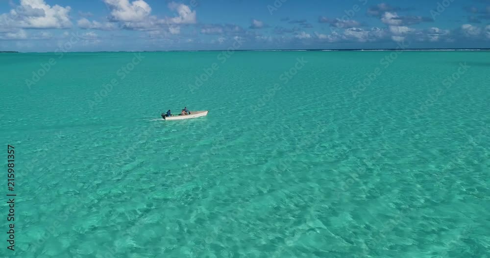A couple in a boat in aerial view, French Polynesia A couple in a boat in aerial view, French Polynesia