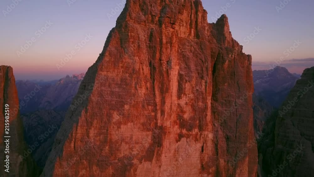 tre cime di lavaredo drone aerial view at sunset flying close to the top