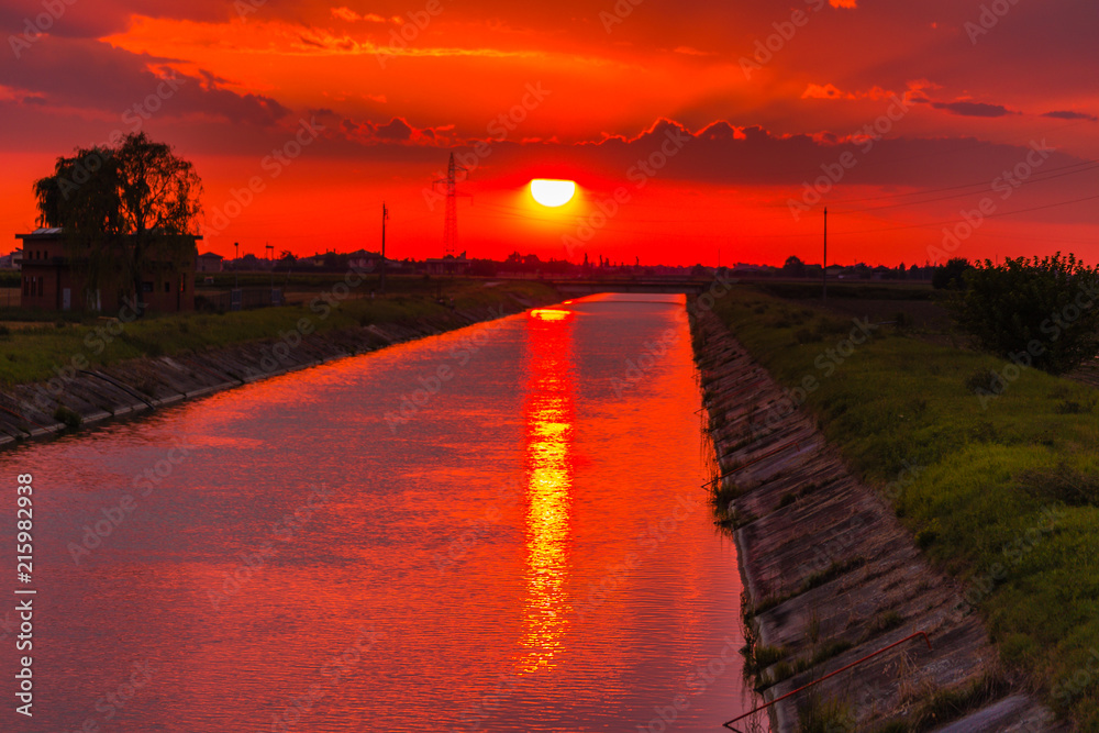 sunset sky on irrigation channel
