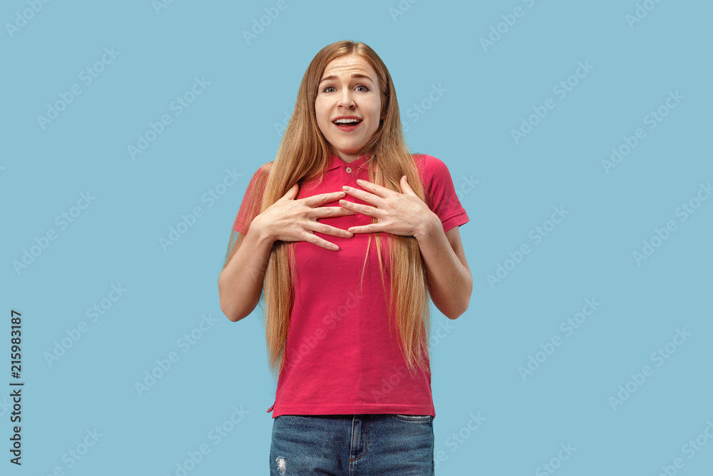 Beautiful woman looking suprised isolated on blue Beautiful woman looking suprised isolated on blue