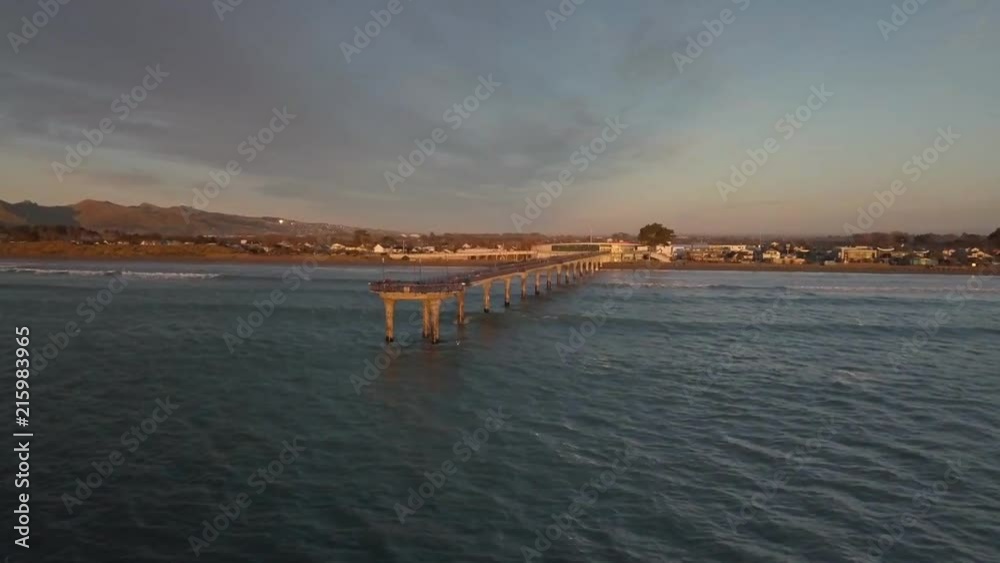 Sunset over the New Zealand ocean and pier. Aerial footage, New Brighton beach, Christchurch. Sunset over the New Zealand ocean and pier. Aerial footage, New Brighton beach, Christchurch.