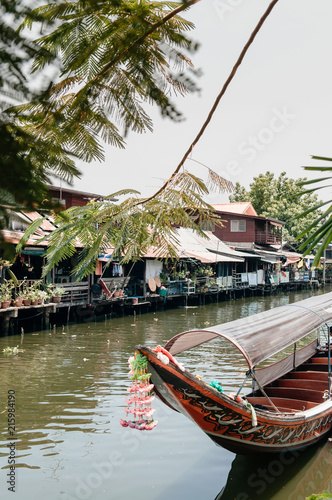 Photography Thai old wooden houses along Bangkok Yai canal or Klong Bang Luang with long tai