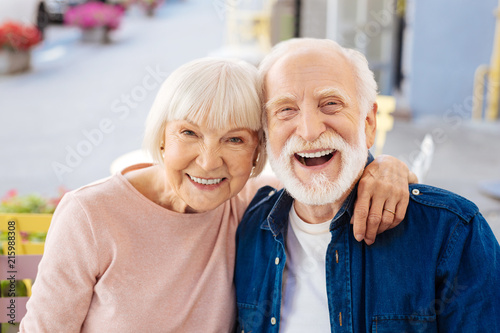 Strong relationships. Gay senior couple making laugh and looking at camera
