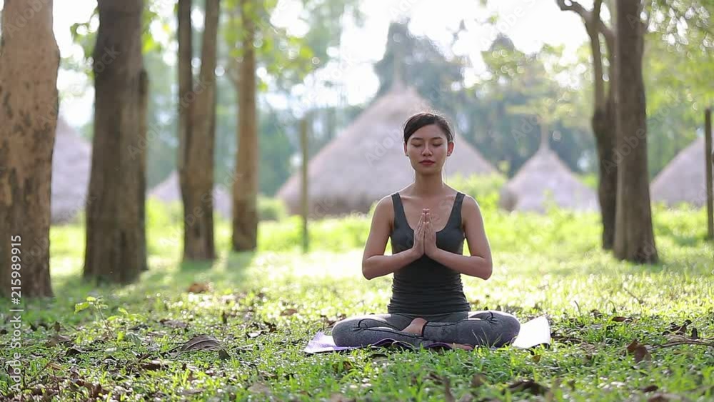 Lady practicing yoga in park outdoor. Meditation. Lady practicing yoga in park outdoor. Meditation.