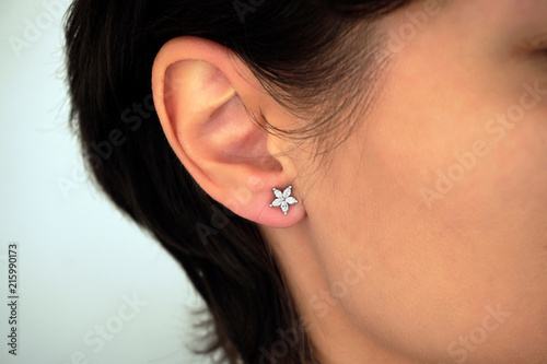 Woman wearing amazing earrings with diamonds