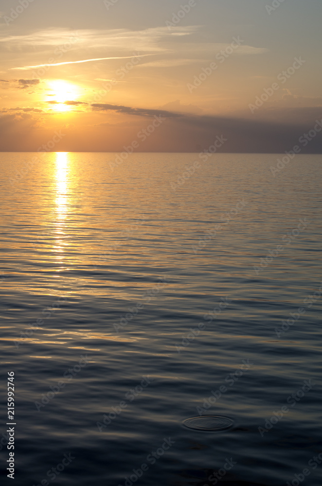 Obraz premium Golden sunset with reflection on the sea in Palanga, Lithuania.
