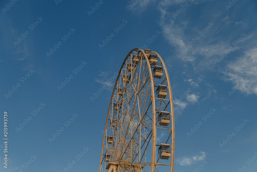 Very large Ferris wheel against the blue sky.