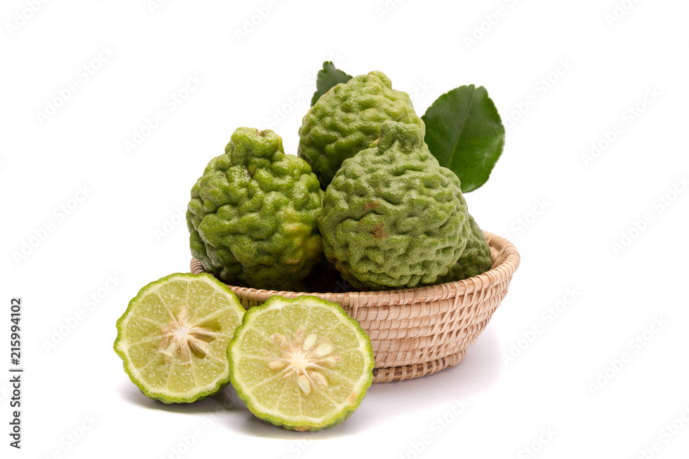 Fototapeta premium The kaffir lime leaves in the basket on a white background.