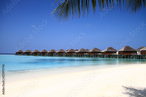 Fototapeta Naklejka Na Ścianę i Meble -  Maldives Island Resort Beach and Overwater Bungalows on Pacific Ocean