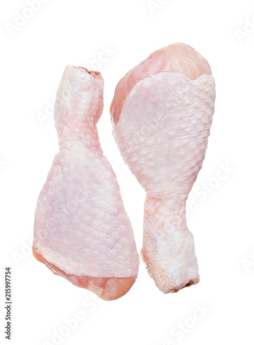 Two Raw chicken leg drumsticks isolated on a white background