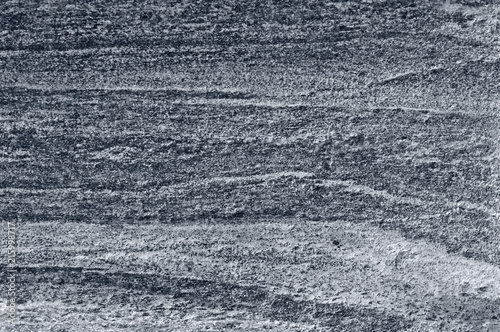 Migmatitic gneiss migmatite rock bands pattern grey light dark banded granite texture macro closeup textured silver gray horizontal background coarse grained feldspar quartz mica minerals gneissic photo