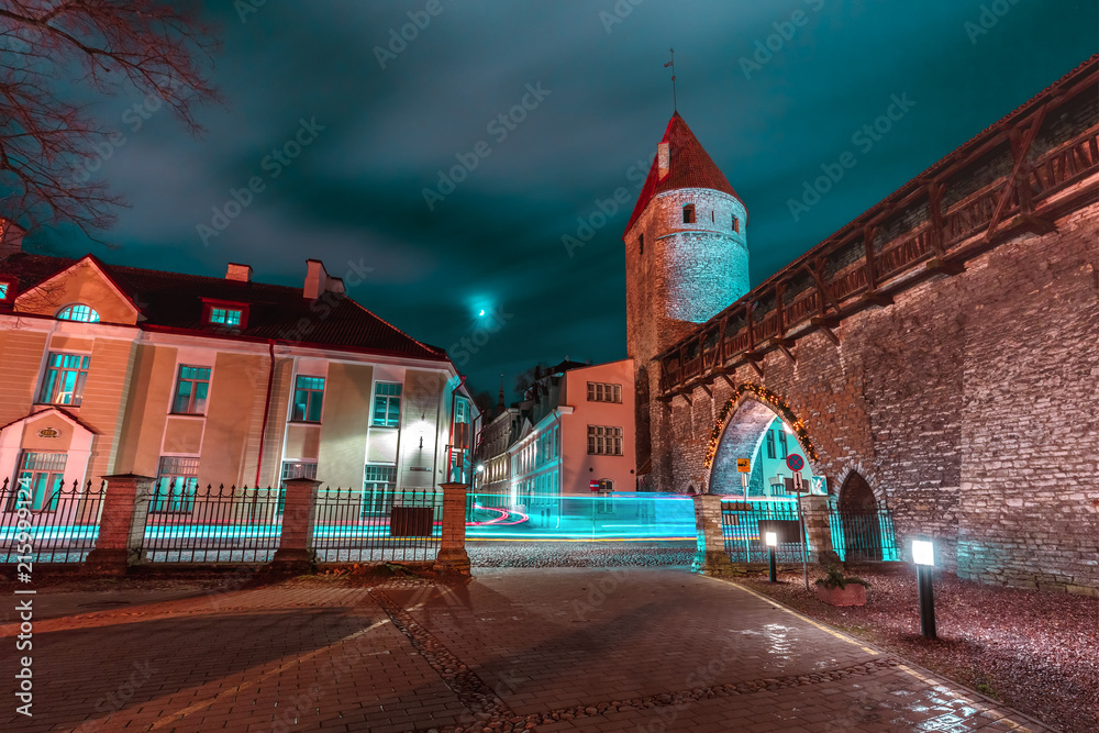 Defensive tower of the Tallinn city wall Nunnatorn and Monastery Gate in Medieval Old Town at night, Tallinn, Estonia