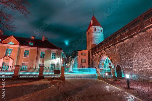 Defensive tower of the Tallinn city wall Nunnatorn and Monastery Gate in Medieval Old Town at night, Tallinn, Estonia photo