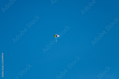 Background colorful balloons flying in the blue sky