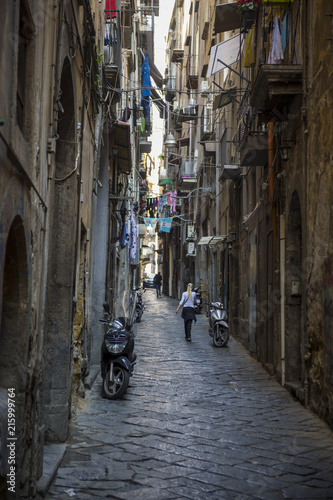 View of dark shady alley of Naples' historic center.