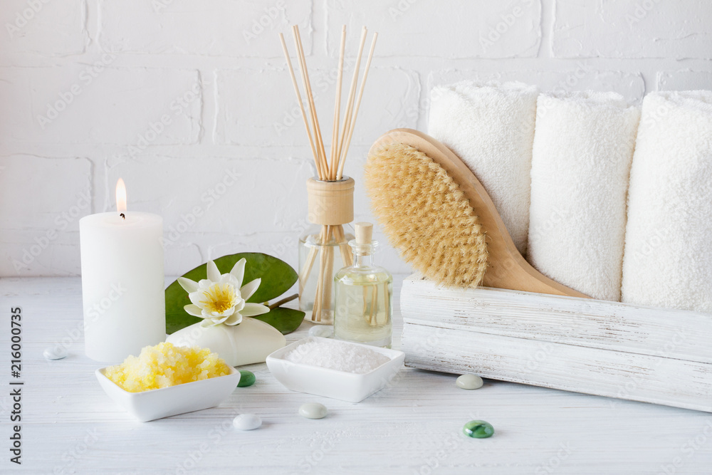 Spa treatment  - towels aromatic soap, bath salt, and oil, and accessories for massage and bathroom.
