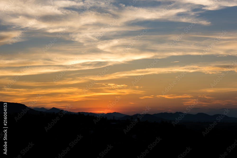 Cloudscape after sunset above the silhouette hills Cloudscape after sunset above the silhouette hills