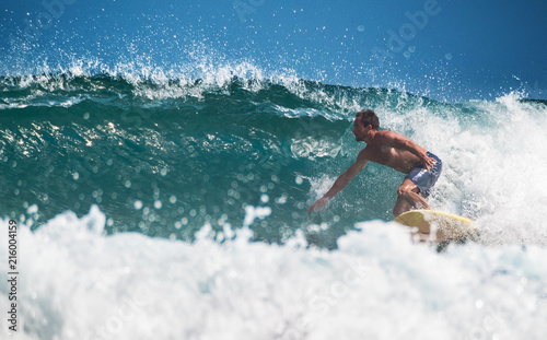 Amateur surfer rides the ocean wave © Dudarev Mikhail