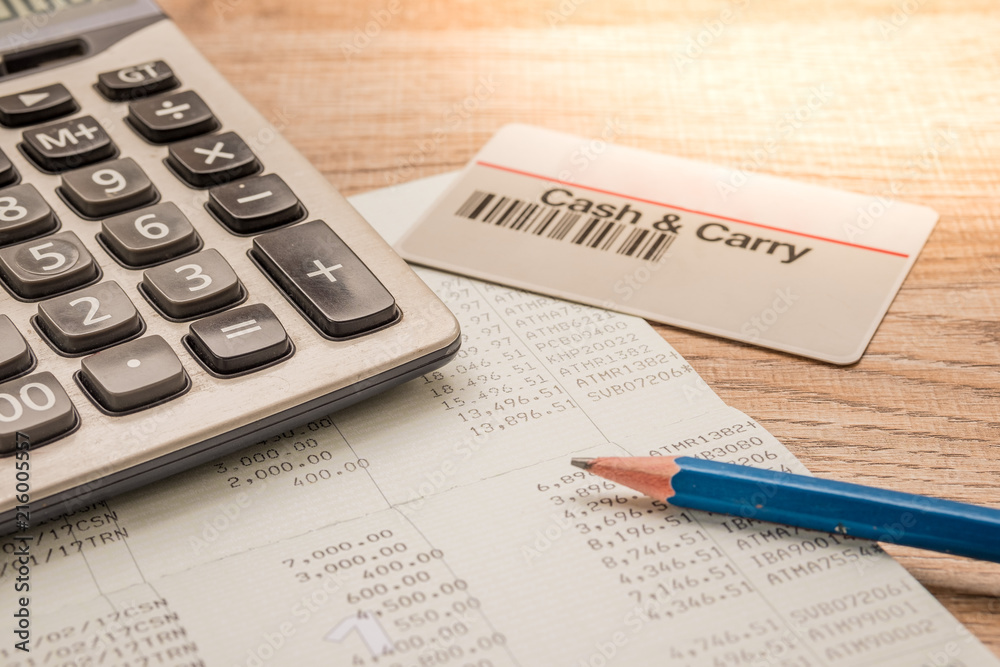 Calculator, cash card, pencil, bankbook Put on a wooden table. Calculator, cash card, pencil, bankbook Put on a wooden table.