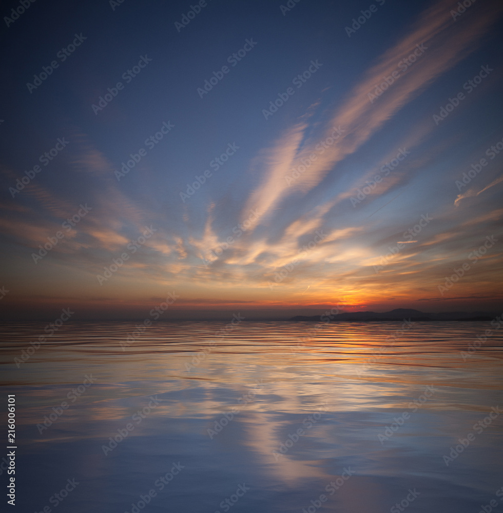 Sea with beautiful sky and reflection at sunset