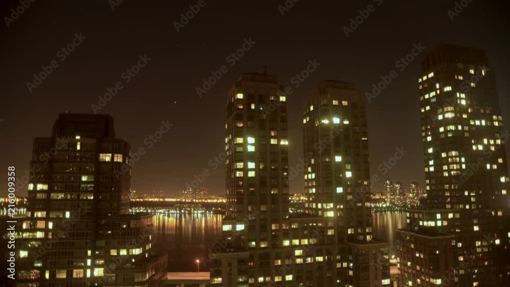 Timelapse of NYC building windows changing and stars passing. Timelapse of NYC building windows changing and stars passing.